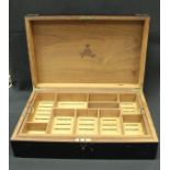 A Monte Christo habana ebonised and brass bound humidor with lift out tray