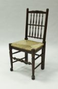 A matched set of eight 19th Century North Country spindle back rush seat dining chairs on turned