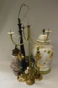 A pair of modern painted metal four light three branch pricket candlesticks,