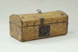An early 19th Century miniature studded leather covered dome top trunk with paper-lined interior,
