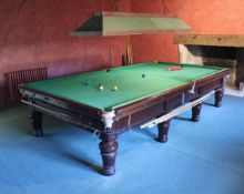 A Burroughes and Watts full size snooker table mahogany framed with green baize,