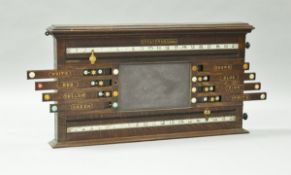 An oak framed billiards/snooker scoreboard by Cox & Yeman of London,