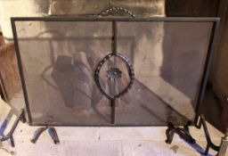 A pair of spark guards of large proportions with wrought iron handle and decoration, 88cm high,