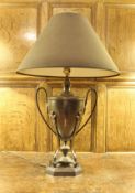 A modern anodised brass table lamp of Regency urn form, decorated with Prince of Wales feathers,