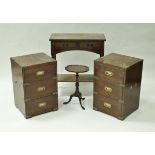 A pair of modern mahogany and brass bound three drawer bedside chests,