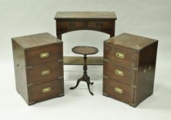 A pair of modern mahogany and brass bound three drawer bedside chests,