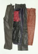 A collection of vintage Yves Saint Laurent Rive Gauche leather trousers, skirts etc,