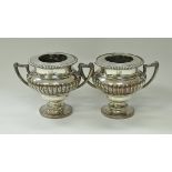 A pair of large 19th Century Sheffield plate wine coolers of urn form with twin handles,