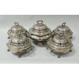 A set of four 19th Century silver plated twin-handled tureens, each with foliate decorated handle,