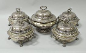 A set of four 19th Century silver plated twin-handled tureens, each with foliate decorated handle,