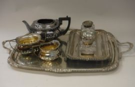 A plated three piece tea set in the Victorian taste with applied scrolling decoration,