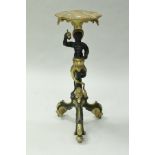 A painted and gilded figural torchere in the 18th Century Venetian taste,