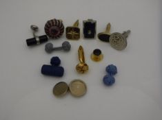 A collection of cufflinks to include a pair of 9 carat gold cufflinks the front set with stars and