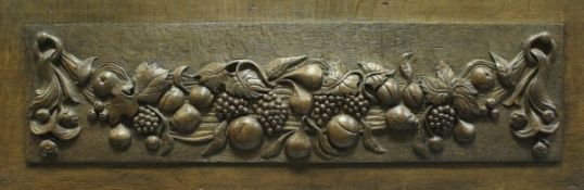 An 18th Century carved oak panel,