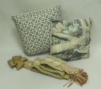 Three boxes of assorted scatter cushions of pink and cream hues together with two green ground bell