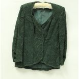 A collection of Bruce Oldfield clothing, comprising green lace top and matching velvet skirt,