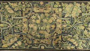 A 19th Century needlework panel depicting fruit and scrolling decoration on a navy ground within a