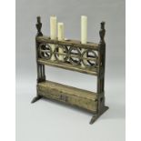 A walnut four section candle holder in the 17th Century Spanish manner,