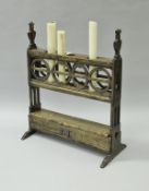 A walnut four section candle holder in the 17th Century Spanish manner,