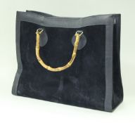 A Gucci handbag of navy suede and leather with bamboo handles CONDITION REPORTS