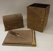 A modern Italian brown suede covered and brass chain embellished desk set comprising stationery box,