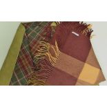 An Yves St Laurent Rive Gauche alpaca and wool checked scarf in autumnal colours together with