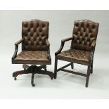 A modern buttoned brown leather swivel office armchair in the 18th Century style,