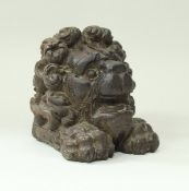 A carved oak lion head resting upon paws figure 18cm high