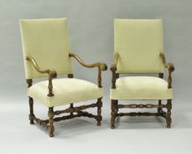 A pair of 19th Century walnut framed hall chairs in the 17th Century Flemish or William and Mary
