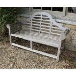 A modern teak Lutyens design scroll arm slatted bench,