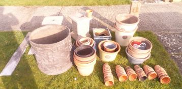 A collection of various glazed and/or terracotta plant pots,