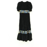 A collection of clothing comprising a 1970s velvet maxi dress, two 1980s black dresses,