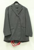 A collection of gentlemen's clothing comprising a Buckleigh of London three piece suit in black and