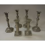 A set of four modern white metal candlesticks in the 18th Century manner, 24.