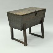 An 19th Century oak dough bin, the single piece top on iron hinges, with hasp and staple clasp,