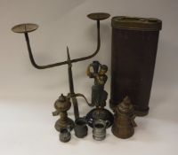 An iron twin pricket candlestick, a pair of spelter figures of blackamoor water carriers,