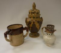 A 19th Century stoneware puzzle jug with applied countryside scenes, 16.