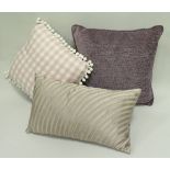 Four boxes of assorted pink and purple hued scatter cushions