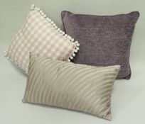 Four boxes of assorted pink and purple hued scatter cushions