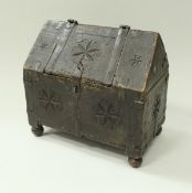 A 19th Century Indian carved wooden casket with iron bound embellishments and geometric medallion