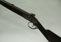 A 19th Century hammer action muzzle loading double barrel shot gun with engraved metal work and