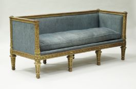 A 19th Century carved giltwood and gesso framed sofa with all over oak leaf and acorn decoration