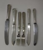 A collection of assorted plated cutlery to include fish knives and forks,