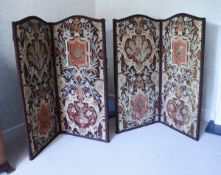 A pair of 20th Century upholstered two fold screens in the Continental taste decorated with