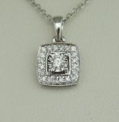 An 18 carat white gold diamond-set pendant,