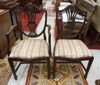 A set of ten mahogany shield-back dining chairs with wheat-ear decoration (eight plus two)