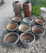 A collection of eight various green / blue hued glazed garden pots
