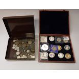 A boxed collection of various modern day commemorative coins including Charles Darwin one dollar,