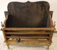 A modern cast iron and brass fire basket together with two further fire baskets and a pair of fire