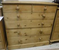A Victorian pine chest of two short over four long drawers